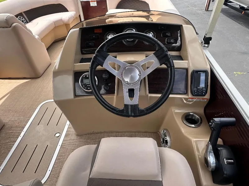 Slide: The Image of 2018 Bennington 23SSBXP boat dashboard with steering wheel and controls. - 6