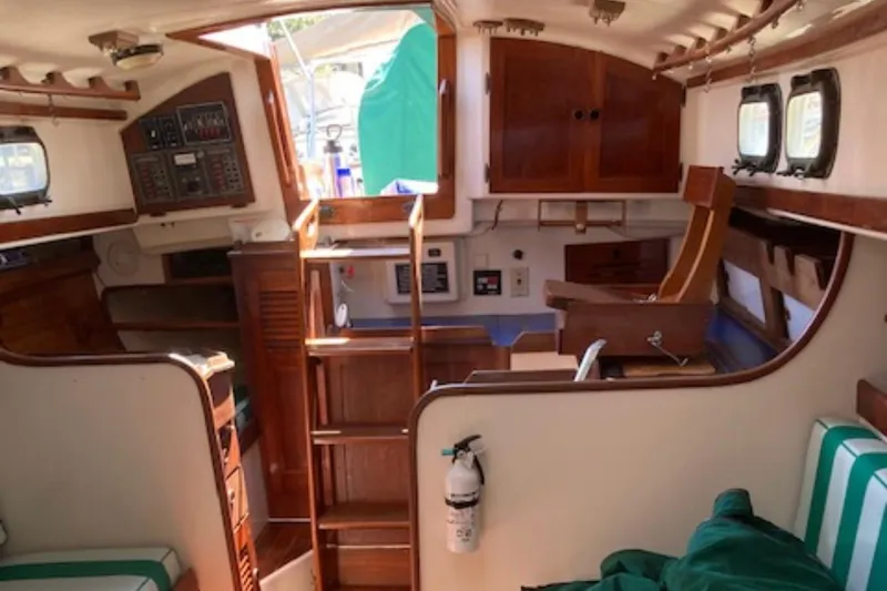 Slide: The Image of Interior of 1981 Sea Sprite 34 sailboat with wooden cabinetry and nautical decor. - 6