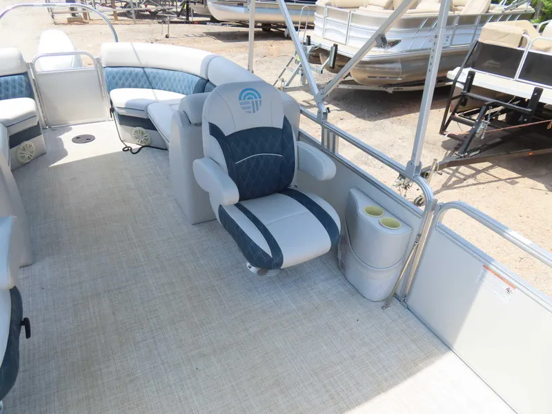 Slide: The Image of 2022 Nepallo pontoon boat interior with cushioned seating and cup holders. - 16