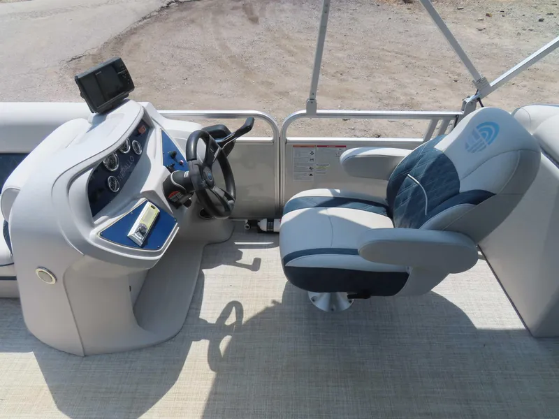 Slide: The Image of 2022 Nepallo pontoon boat interior with steering console and captain's chair. - 19