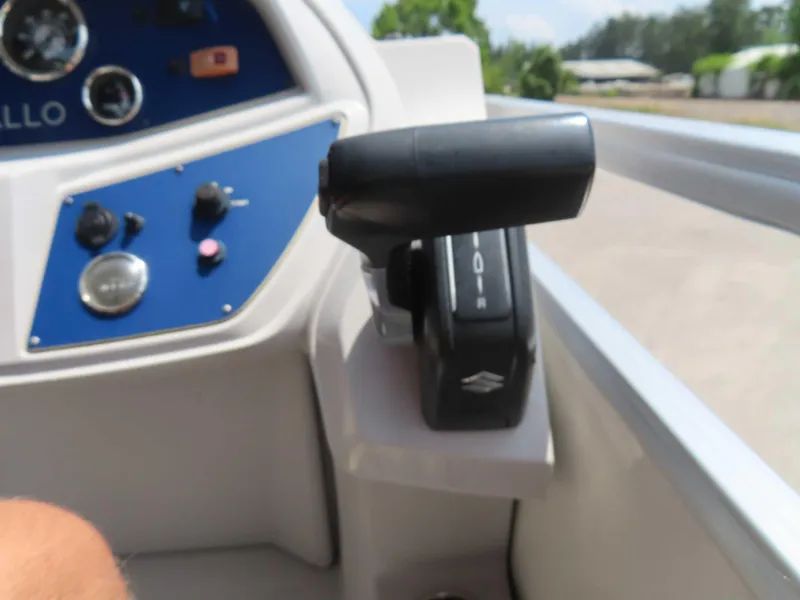 Slide: The Image of Close-up of 2022 Nepallo pontoon boat controls and throttle lever. - 22