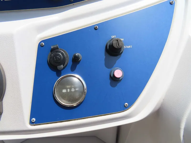 Slide: The Image of Control panel of a 2022 Nepallo pontoon boat with ignition and switches. - 23
