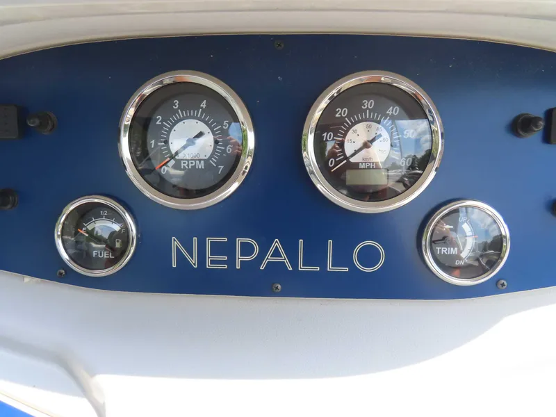 Slide: The Image of Dashboard of a 2022 Nepallo pontoon boat with gauges for RPM, speed, fuel, and trim. - 26