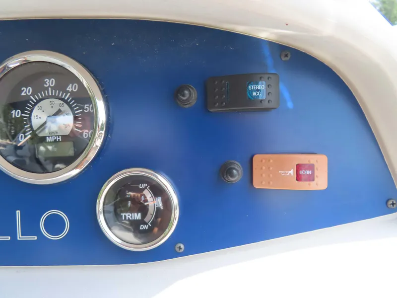Slide: The Image of Dashboard of a 2022 Nepallo pontoon with speedometer and control switches. - 27
