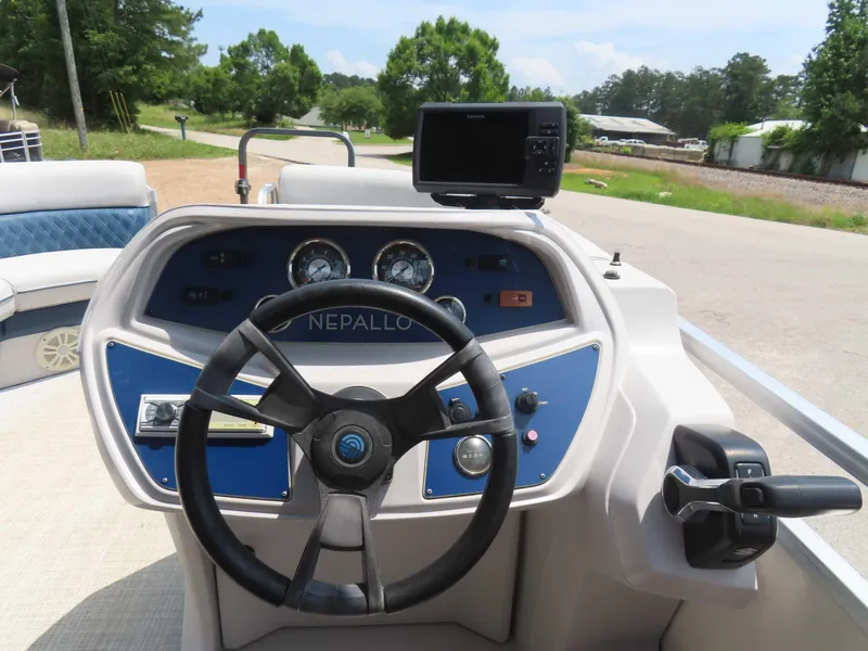 Slide: The Image of 2022 Nepallo pontoon boat dashboard with steering wheel and control panel. - 28