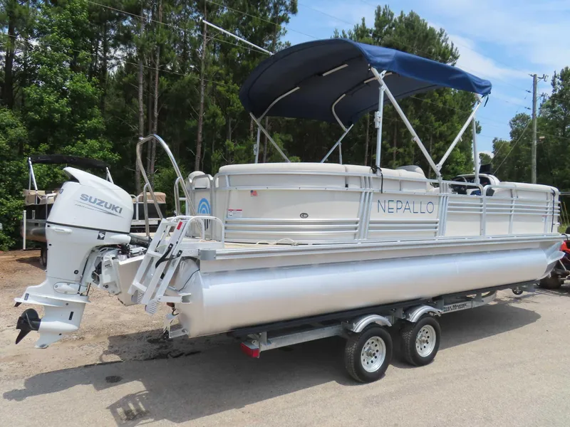Slide: The Image of 2022 Nepallo pontoon boat with Suzuki outboard motor on a trailer. - 3