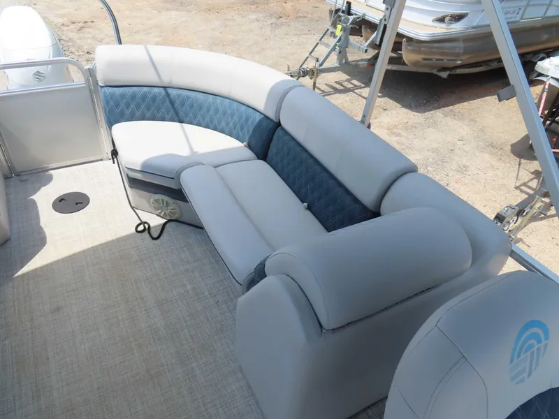 Slide: The Image of 2022 Nepallo pontoon boat interior with plush seating and modern design. - 30
