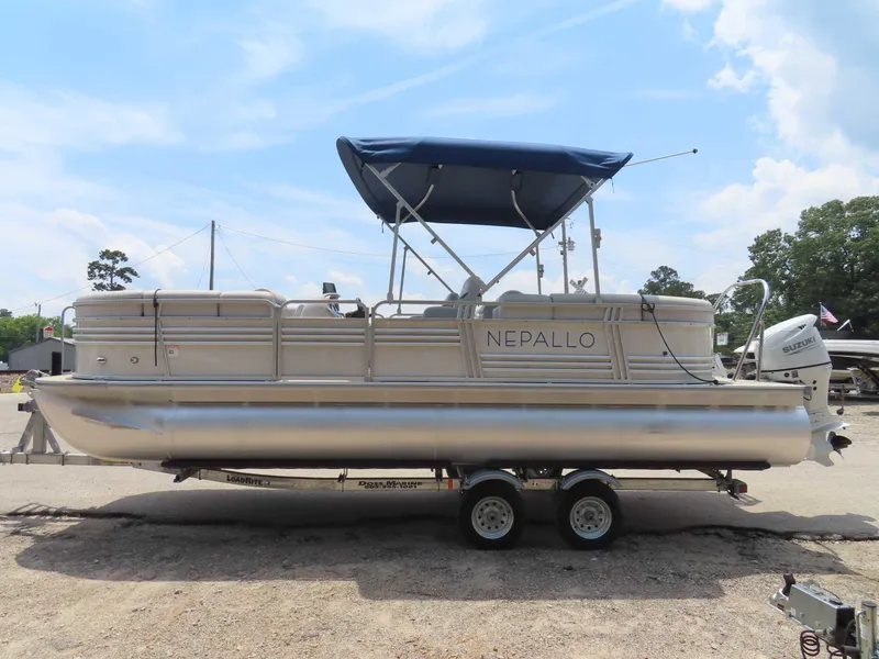 Slide: The Image of 2022 Nepallo pontoon boat with canopy on trailer, parked outdoors. - 6