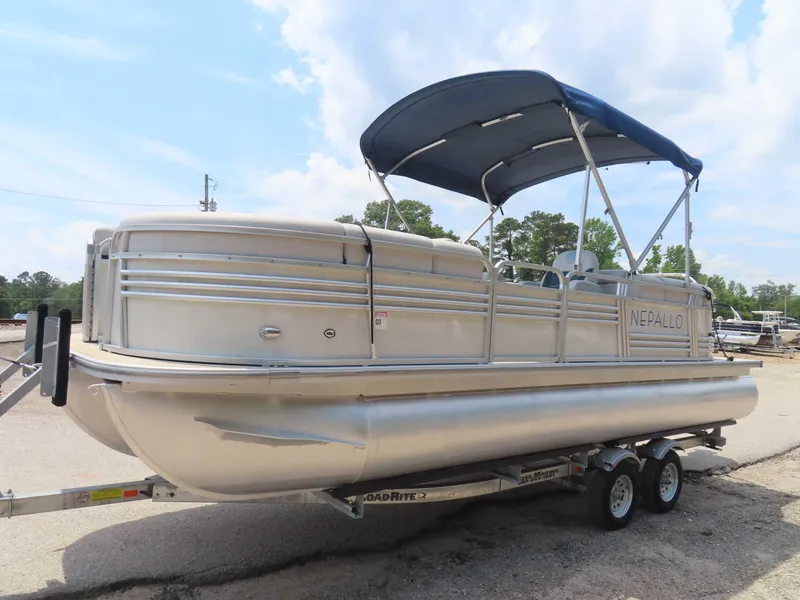 Slide: The Image of 2022 Nepallo pontoon boat on trailer under blue sky. - 7