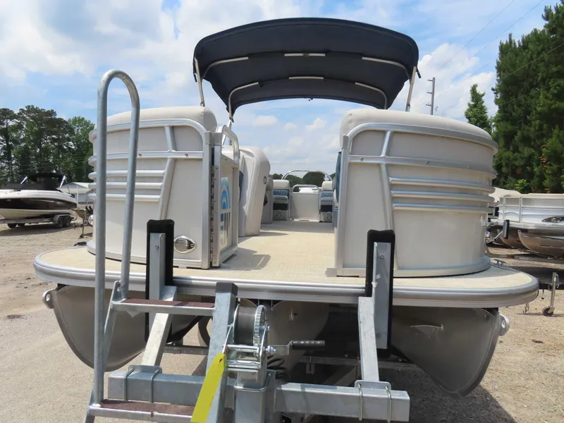 Slide: The Image of 2022 Nepallo pontoon boat with canopy on trailer, parked outdoors. - 8