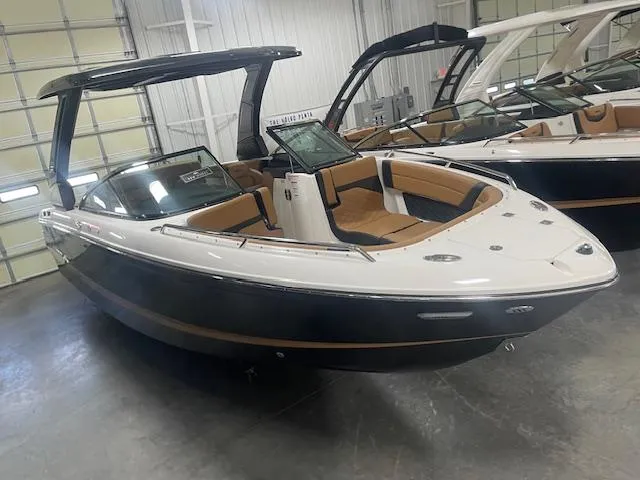 Slide: The Image of 2025 Chaparral 267 SSX boat in showroom, featuring sleek design and modern amenities. - 3