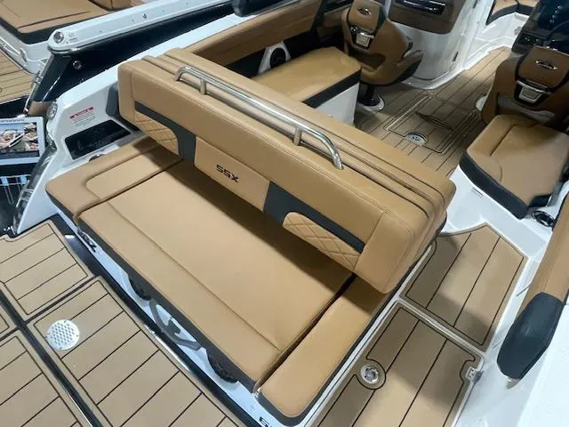 Slide: The Image of 2025 Chaparral 267 SSX boat interior with tan leather seating and modern design. - 4