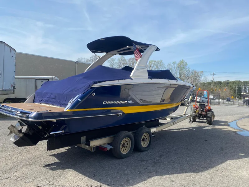 Slide: The Image of 2018 Chaparral 267 SSX boat on trailer, covered and ready for transport. - 3