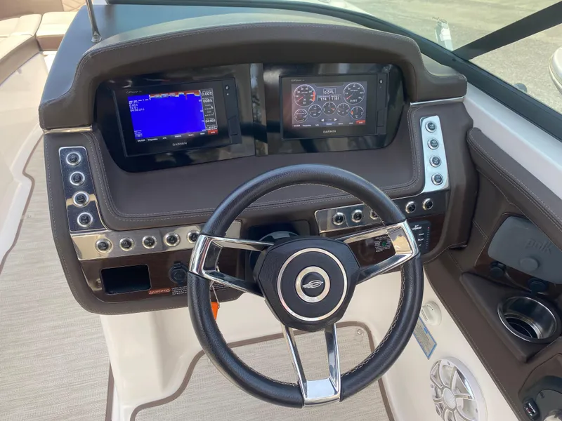 Slide: The Image of Dashboard of 2018 Chaparral 267 SSX boat with steering wheel and digital displays. - 7