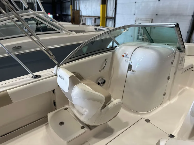 Slide: The Image of 2019 Robalo R207 Dual Console boat interior with white seating and console. - 11
