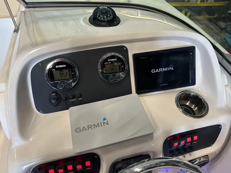 Slide: The Image of Dashboard of 2019 Robalo R207 Dual Console with Garmin navigation system and Yamaha gauges. - 27