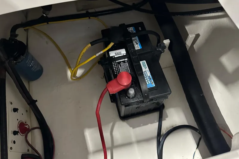 Slide: The Image of Battery compartment of a 2019 Robalo R207 Dual Console boat. - 28