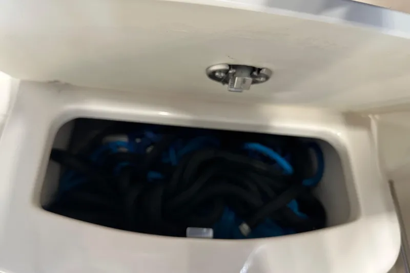Slide: The Image of Storage compartment on 2019 Robalo R207 Dual Console boat. - 31