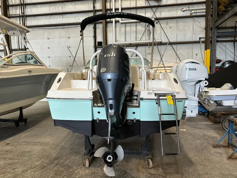 Slide: The Image of 2019 Robalo R207 Dual Console boat in storage with Yamaha outboard motor. - 4