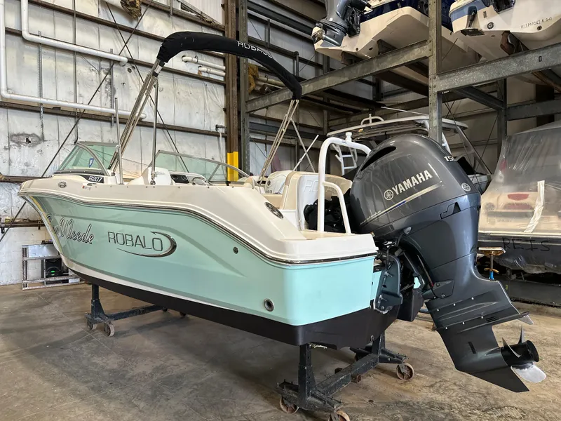 Slide: The Image of 2019 Robalo R207 Dual Console boat with Yamaha engine in storage facility. - 5
