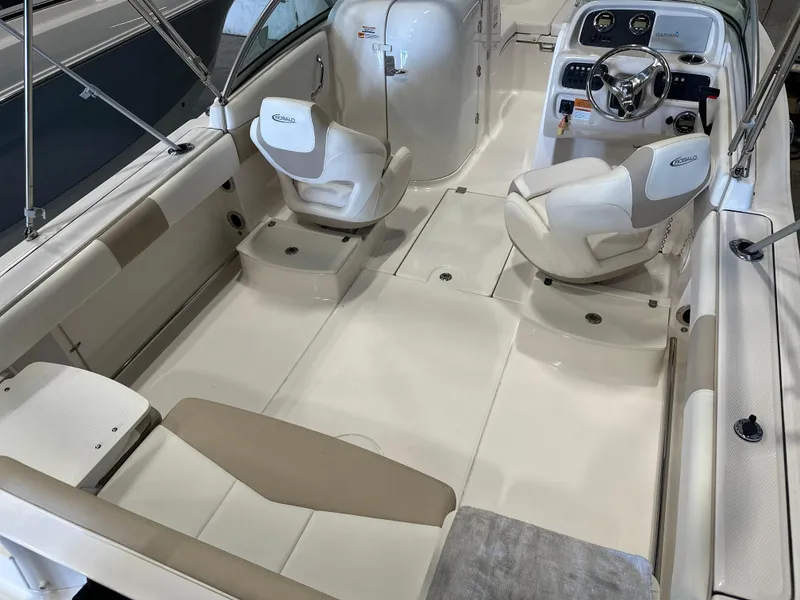 Slide: The Image of 2019 Robalo R207 Dual Console boat interior with seating and steering console. - 6