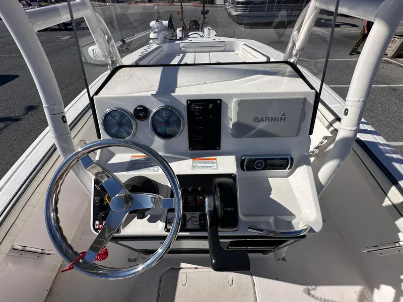 Slide: The Image of 2017 Yamaha Boats 190 FSH Sport dashboard with Garmin navigation system and steering wheel. - 10