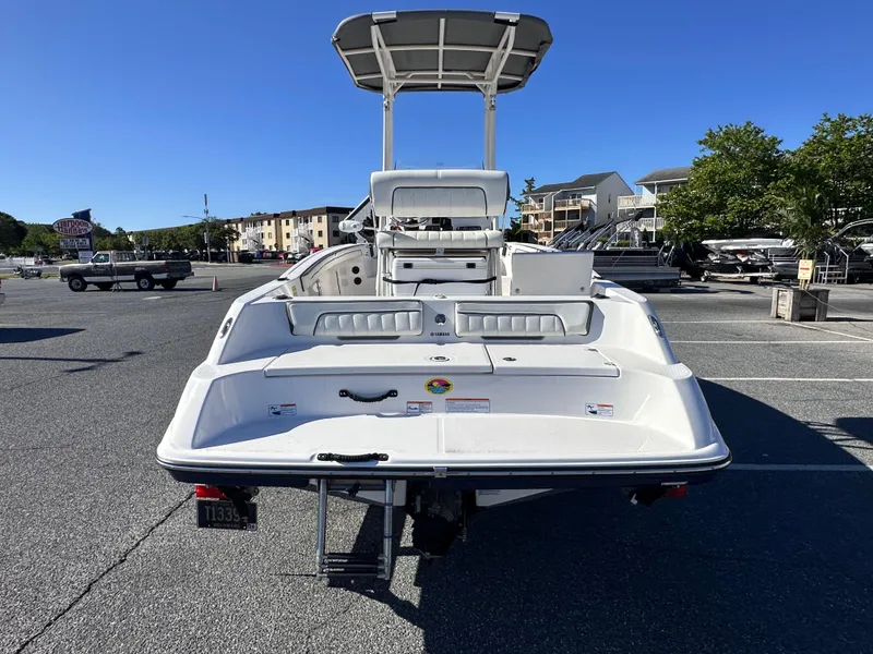 Slide: The Image of 2017 Yamaha Boats 190 FSH Sport in parking lot, rear view. - 3
