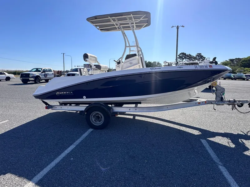 Slide: The Image of 2017 Yamaha Boats 190 FSH Sport on trailer in parking lot, sunny day. - 5