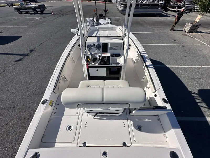 Slide: The Image of 2017 Yamaha Boats 190 FSH Sport, center console view, parked in a marina. - 8