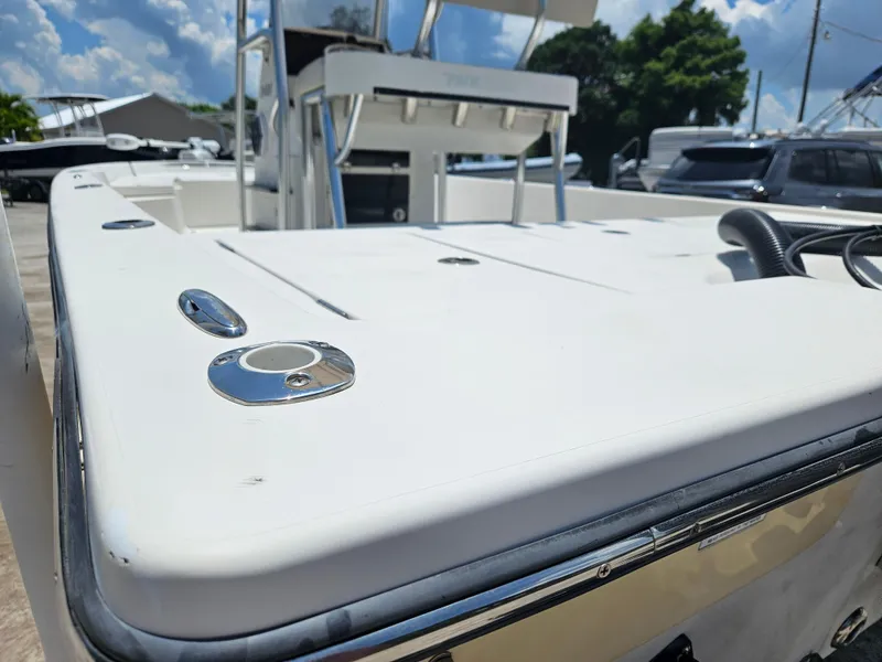 Slide: The Image of 2011 Pathfinder 2400 Tournament Edition boat deck with seating, under a clear blue sky. - 11