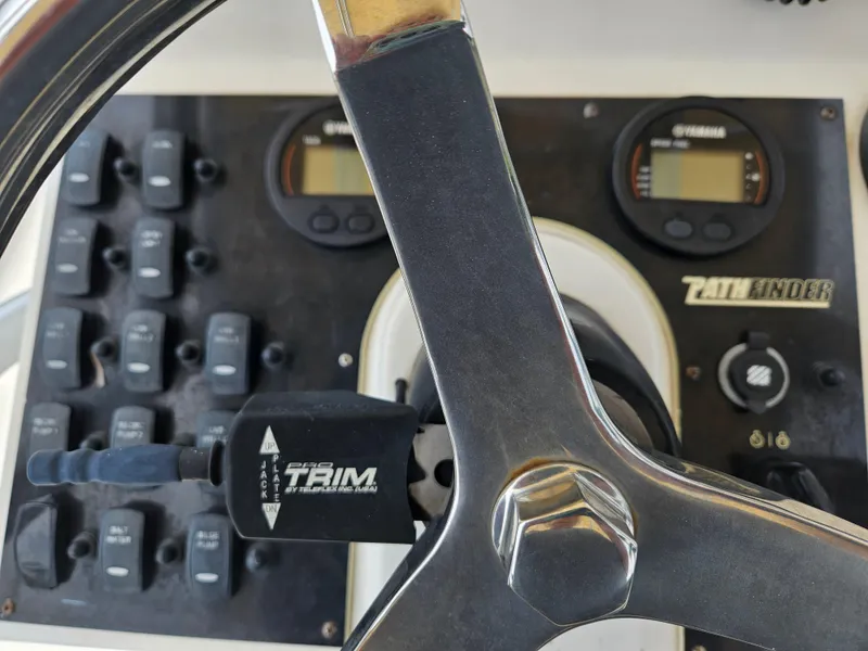 Slide: The Image of Steering wheel and controls of 2011 Pathfinder 2400 Tournament Edition boat. - 18
