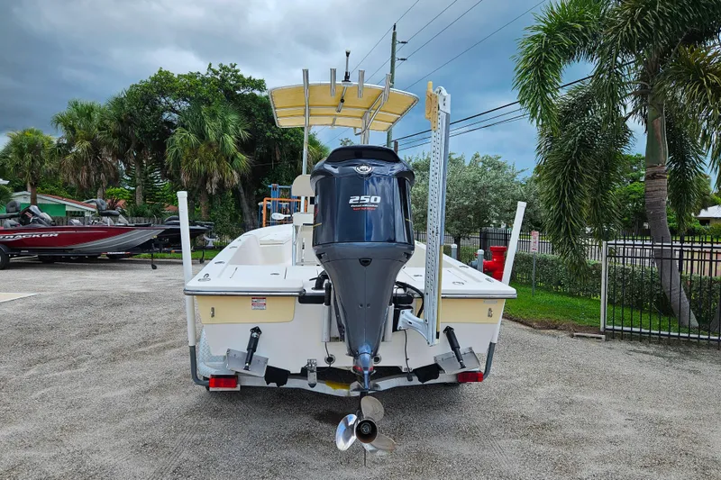 Slide: The Image of 2011 Pathfinder 2400 Tournament Edition boat with 250 horsepower engine, parked outdoors. - 3