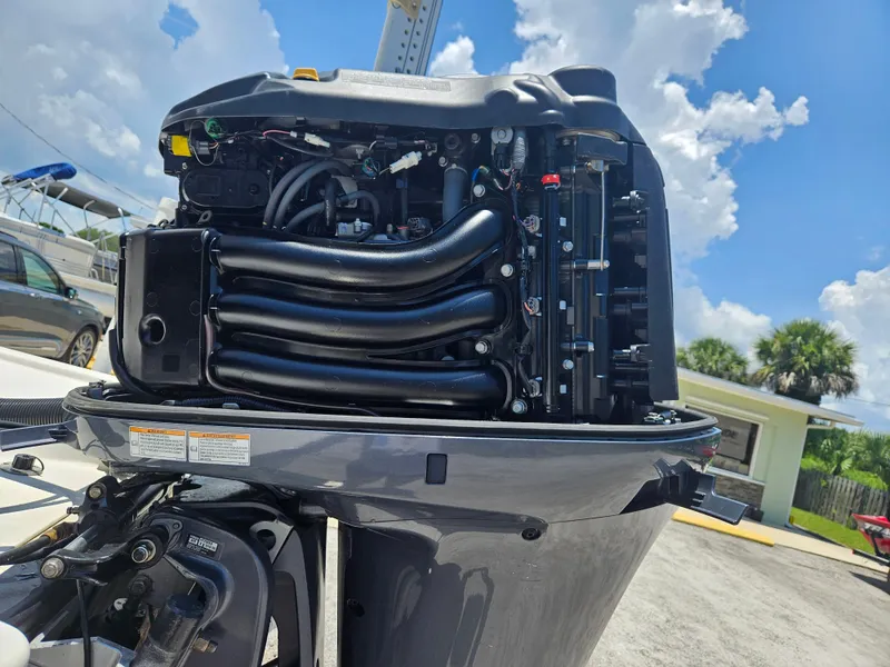 Slide: The Image of 2011 Pathfinder 2400 Tournament Edition outboard motor, detailed view under sunny sky. - 5