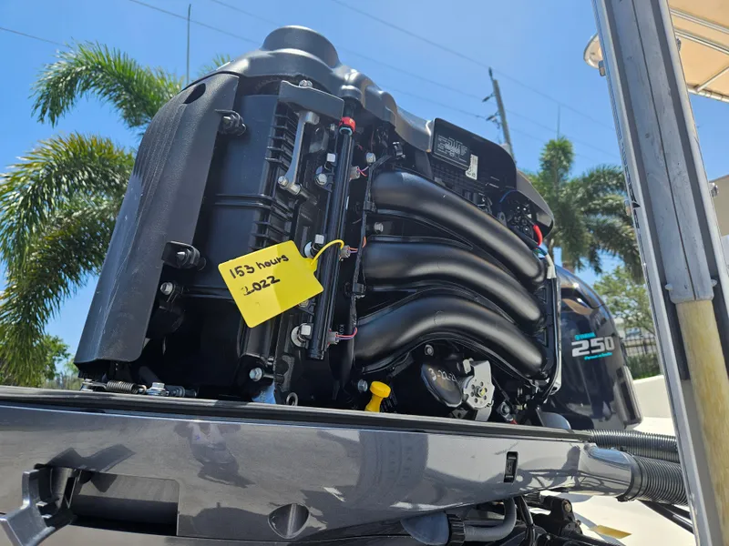 Slide: The Image of Outboard motor of a 2011 Pathfinder 2400 Tournament Edition boat with 153 hours usage. - 6