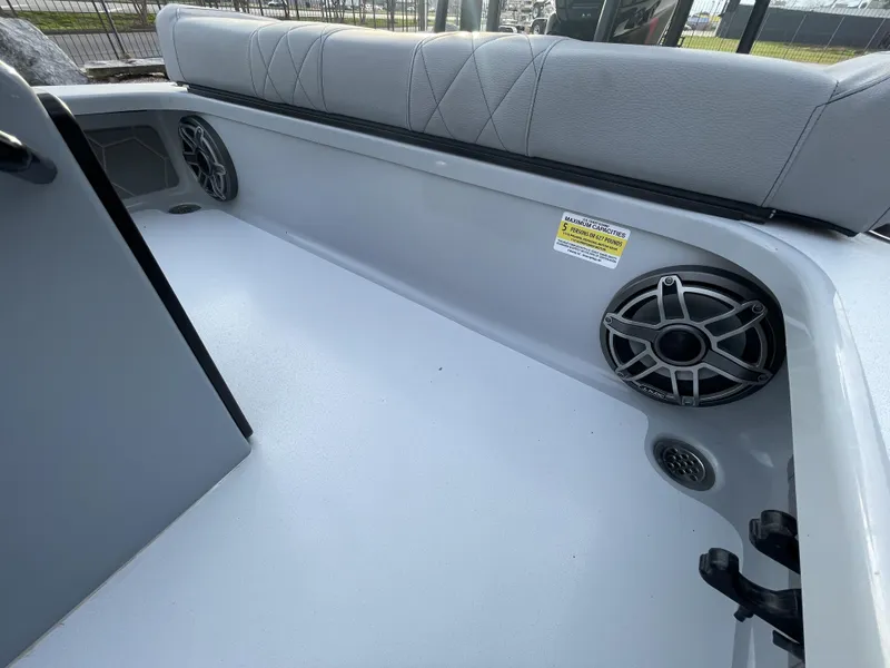 Slide: The Image of Interior of 2023 ZCB 18 Curlew boat with seating and speaker system. - 12
