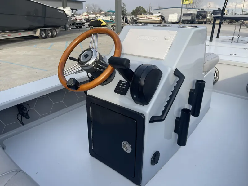 Slide: The Image of 2023 ZCB 18 Curlew boat console with wooden steering wheel and control panel. - 7