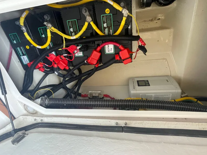 Slide: The Image of Electrical system of 2023 Ranger Tugs R-25 boat with batteries and wiring. - 13