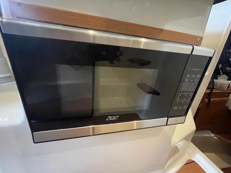 Slide: The Image of Built-in microwave in 2023 Ranger Tugs R-25 boat kitchen. - 26