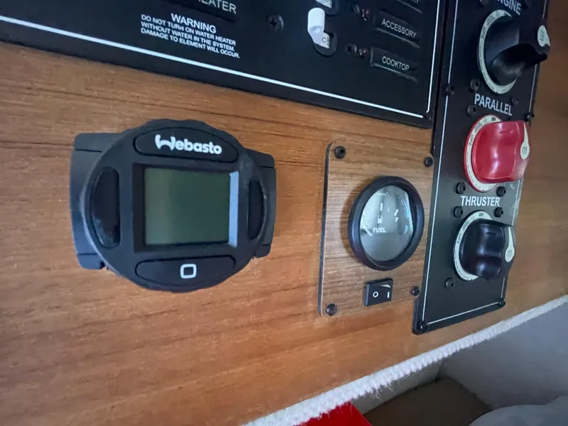 Slide: The Image of Control panel of 2023 Ranger Tugs R-25 with Webasto display and thruster controls. - 34