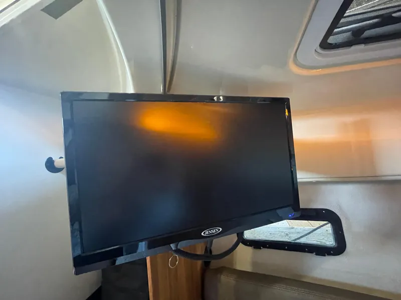Slide: The Image of Flat-screen TV inside 2023 Ranger Tugs R-25 boat cabin. - 39