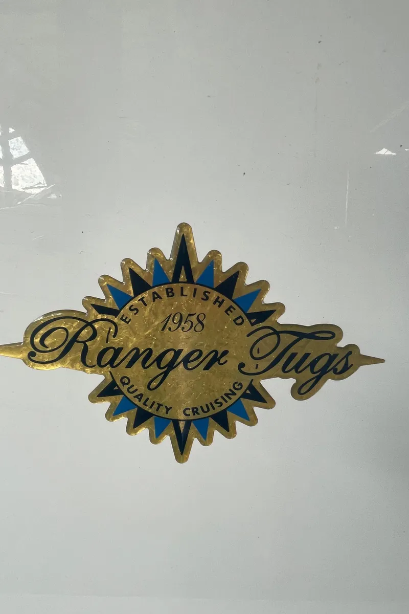 Slide: The Image of Ranger Tugs emblem, established 1958, quality cruising, 2023 R-25 model. - 45
