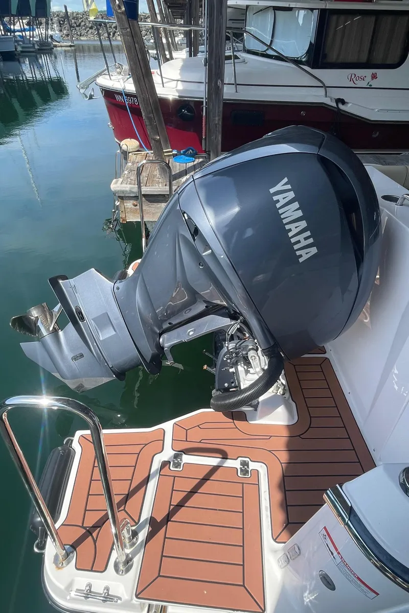 Slide: The Image of 2023 Ranger Tugs R-25 with Yamaha outboard motor at marina. - 7