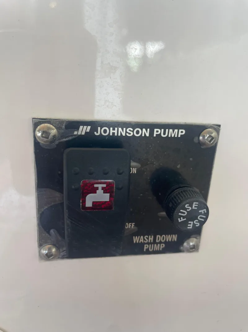Slide: The Image of Johnson Pump control panel on 2023 Ranger Tugs R-25 boat. - 9