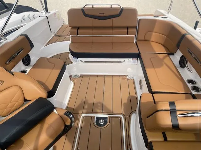 Slide: The Image of 2023 Chaparral 247 SSX boat interior with tan leather seating and sleek design. - 3