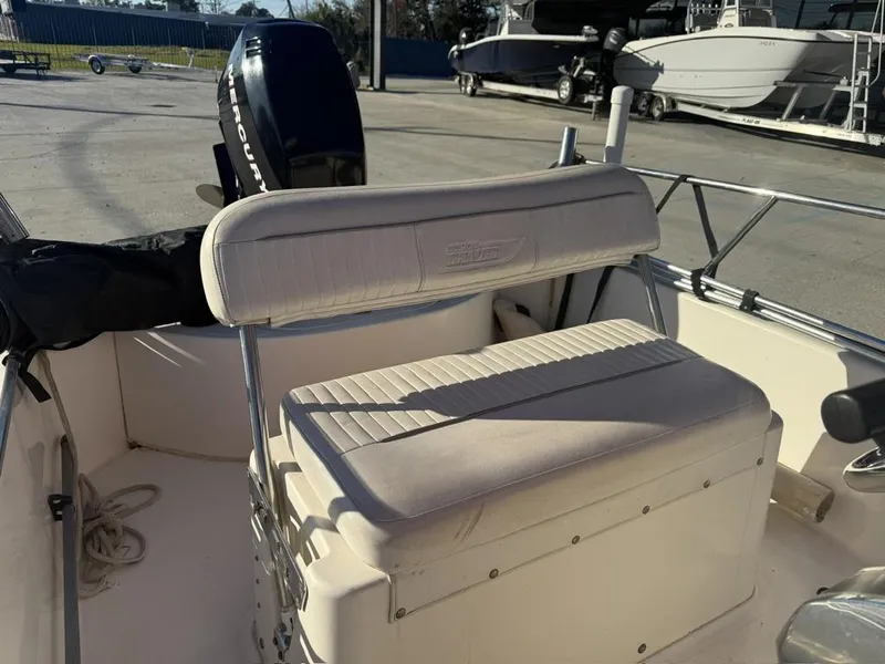 Slide: The Image of 2007 Boston Whaler 150 Montauk interior with seating and Mercury outboard motor. - 6