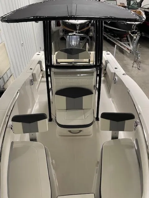 Slide: The Image of 2025 Robalo R202 Explorer boat interior with seating and canopy. - 5