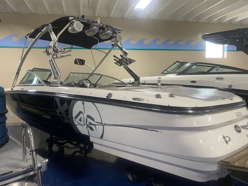 Slide: The Image of 2008 MasterCraft X 45 boat with wakeboard tower in indoor showroom. - 0