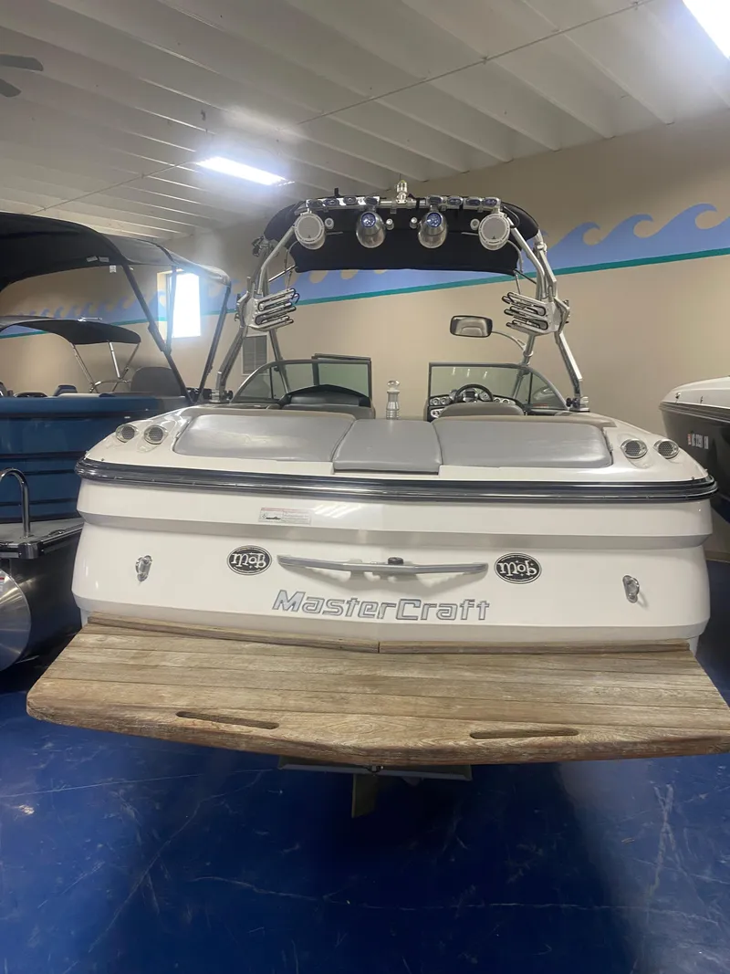 Slide: The Image of 2008 MasterCraft X 45 boat in showroom, rear view with wakeboard tower. - 2