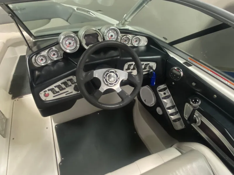 Slide: The Image of 2008 MasterCraft X 45 boat dashboard with steering wheel and gauges. - 4