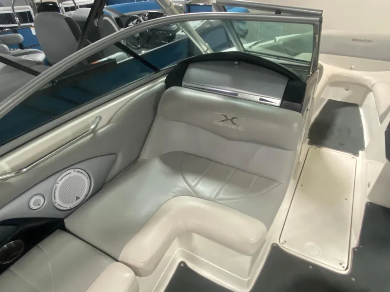 Slide: The Image of 2008 MasterCraft X 45 boat interior with gray seating and speaker system. - 5